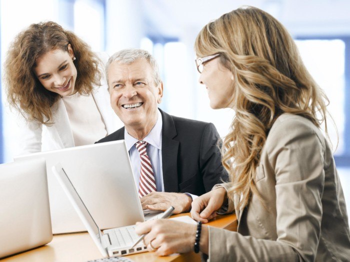 Mature business man discussing project with his colleagues