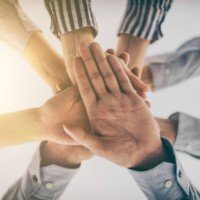 Hands stacked in a pile